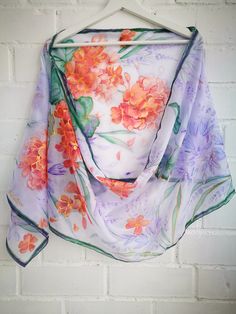 Hand painted Recherché silk scarf -Violet Brodiaea (Cluster lilies) flowers and coral geraniums in soft purple lavender air. Scarf painted on Ponge silk (sometimes called habotai). It is light, soft, just a little glossy and slightly sheer silk. ------------------------------------------------------------------------------------------------------------------ This scarf is MADE TO ORDER and available even in 6 OBLONG sizes and 3 SQUARES: 21x21 inches (55x55cm)- Very small square- Kerchief; wrist, Purple Silk Scarves With Floral Print, Purple Silk Scarves For Spring, Purple Silk Scarf With Floral Print For Spring, Purple Bohemian Scarves With Floral Print, Purple Floral Print Silk Scarf For Spring, Summer Purple Silk Scarf As A Gift, Purple Silk Scarf For Summer Gift, Summer Gift Purple Silk Scarf, Purple Silk Shawl Scarf