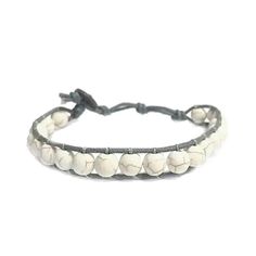 This rad bracelet is an easy accessory for any occasion! Casual Round Beads Wrap Bracelet For Friendship, Casual Beaded Wrap Bracelet For Friendship, Casual Hand-wrapped Beaded Bracelets, Casual Braided Bracelets With Round Beads For Festivals, Casual Hand-strung Jewelry For Festivals, Casual Adjustable Wristband For Everyday, Adjustable Casual Everyday Wristband, Adjustable Casual Wristband For Everyday, Casual Beaded Leather Bracelet As A Gift