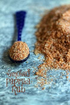 a spoon full of ground paprika next to a scoop of powdered paprika