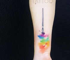 a person's arm with a tattoo on it that has a spoon in it