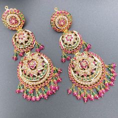 Featuring an intricate and beautifully carved heavy bridal jadau necklace set in 22ct gold. The necklace weighs 114.49 GMs including 13.79 GMs in hanging ruby emerald beads. The earrings weigh 34.81 GMs including 4.68 GMs in hanging ruby emerald beads. Price Breakup Summary Component Rupees % of Total 22k Gold 639,166 75.8% Stones & Beads 64,969 7.7% Making Charges 115,050 13.6% Taxes (GST) 24,576 3.0% Total 843,760 100.0% View Detailed Price Breakup Watch Video Here Watch Video Here2 Traditional Ruby Chandbalis With Intricate Design, Traditional Ruby Kundan Necklace With Meenakari, Traditional Ruby Meenakari Kundan Necklace, Heavy Ruby Chandbali Kundan Necklace, Ruby Chandbali Kundan Necklace With Intricate Design, Green Ruby Jewelry With Intricate Design, Traditional Yellow Gold Ruby Jewelry, Traditional Ruby Meenakari Jewelry, Bollywood Style Ruby Jewelry For Reception