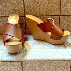 Brown Leather Sandals With Faux Wooden Wedge And Platform Toe. Never Worn, One Small Scuff On Toe (See Picture) True To Size Super Cute For Summer! Summer Beach Wedge Sandals In Faux Leather, Trendy Wedge Sandals With 4-inch Heel For Beach, Beach Wedge Heels With Wooden Heel, Wedge Heels With Wooden Heel For Beach, Beach Heels With Wooden Wedge Heel, Brown Platform Wedge Sandals In Synthetic Material, Brown Platform Wedge Sandals In Synthetic, Beach Faux Leather Wedge Sandals With Removable Insole, Chic Synthetic Wedge Sandals With Wooden Heel