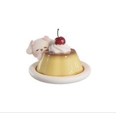 a small white mouse sitting on top of a cake with whipped cream and cherries