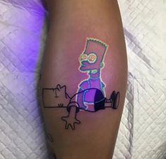 the simpsons tattoo is on someone's leg