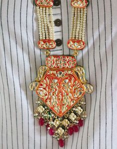 Jadau Kundan Long Rani Haar Necklace Earrings Set, Indian Bridal Wedding Fashion Necklace Earrings Jewellery Set, Minakari Necklace Pearls Free Fast Shipment Metal = Gold Plated Occasion = Wedding ,Party Wear, Bridal Color = Red and White Size = Necklace Length = 15 Inches , Earring Size = 3 Inches 100% Satisfaction Guarantee: 1 Year Warranty, Long Lasting Plating, High-Quality Stones Occasion: Perfect choice for any Indian occasion. Care: It is advisable that you keep products away from direct Handmade Red Beaded Necklaces For Celebration, Handmade Ruby Jewelry For Festive Occasions, Multicolor Ruby Necklace As Gift, Red Faceted Beads Earrings For Festive Occasions, Elegant Red Kundan Necklace As Gift, Traditional Bridal Necklace With Colorful Beads As Gift, Traditional Bridal Necklace With Large Beads As A Gift, Orange Temple Jewelry For Gifts, Orange Temple Jewelry As A Gift