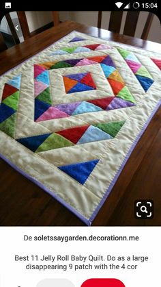 a table with a quilt on it and the words do seusssy garden decoration me best 1 jelly baby quilts do as large diapering 9 patch with the 4 cor