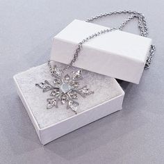 Stainless steel snowflake necklace with small jewels Silver Alloy Flower Pendant Necklace, Silver Alloy Necklace With Flower Pendant, Alloy Rhinestone Pendant Necklace As Gift, Alloy Costume Jewelry Necklaces For Gifts, Elegant Alloy Crystal Necklace For Gift, Costume Jewelry Metal Necklaces For Gifts, Silver Alloy Jewelry Gift For Her, Silver Alloy Jewelry As A Gift For Her, Silver Alloy Necklace For Gift