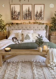 a bedroom decorated for christmas with candles on the bed and trees in the background,