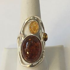 This Sterling Silver Amber Ring Is A Beauty! It Has 2 Amber Stones And A Very Nice Light Amber Stone As Well. It Is Approx. 1 1/2” High And Approx. 1 1/4” Wide. As With All My Items, Unless Otherwise Stated, This Is New Never Worn. I Reply To Questions Via Poshmark “Comments” Only, Not To Private Email/Text. Thank You. Shifting Closet, Rose Gold Opal Ring, Artistic Ideas, Moon And Star Ring, Unusual Rings, Amber Crystal, Amber Ring, Trendy Ring, Eternity Band Ring