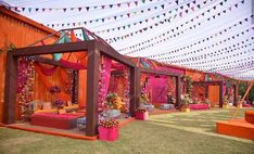 an outdoor wedding venue decorated in bright colors