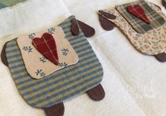 two small pieces of fabric with hearts on them