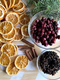 oranges, cranberries and spices on a table