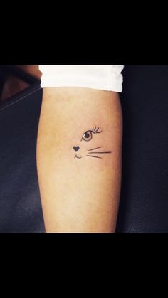 a cat's face is shown on the arm