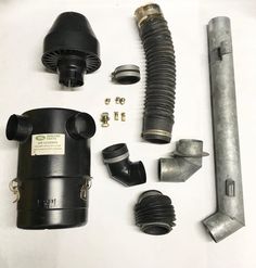 an assortment of different types of air vents and fittings on a white table top