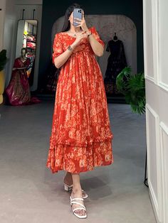 Radiate vibrancy and charm with our stunning collection of orange georgette frock dresses, featuring intricate floral printed work. These dresses are fully stitched and available in sizes XS to L, ensuring a perfect fit for a variety of body types. Made from premium georgette fabric, each dress offers a graceful flow and a lightweight feel, making it an ideal choice for festive occasions and special events. The vibrant orange hue combined with exquisite floral prints makes these frock dresses a Georgette Dress Western, Latest Frock Designs For Women, Frocks Designs For Women, Floral Print Frock, Lehenga Crop Top, Frocks And Gowns, Simple Frock Design, Long Frock Designs, Floral Frocks