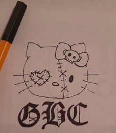 a drawing of a hello kitty with the word diac written on it and an orange marker next to it