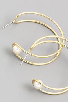 Lux gold and pearl earrings! Gold Metal Hoop Earrings With Pearl Charm, Trendy Gold Pearl Charm Earrings, Gold Hoop Pearl Earrings With Ear Wire, Gold Pearl Hoop Earrings With Ear Wire, Trendy Gold Pearl Earrings, Metal Hoop Earrings With Pearl Drop, Small Hoop Metal Pearl Drop Earrings, Small Hoop Metal Pearl Earrings For Pierced Ears, Trendy Hoop Earrings With Pearl Drop