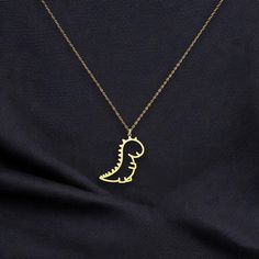 ☆ This Adorable Dinosaur Pendant Necklace brings a fun and playful touch to any outfit, featuring a cute silver dino charm. Perfect for kids, dino enthusiasts, or anyone with a love for whimsical jewelry, this piece makes a delightful gift that sparks imagination and joy. ☆ We craft all our products with love and dedication. This handmade 925 sterling silver necklace is a beautiful gift for yourself or a loved one. We offer custom designs, including personal names or inscriptions. For additional Novelty Dinosaur Print Jewelry Gift, Whimsical Necklace, Dinosaur Pendant, Playful Jewelry, Whimsical Jewelry, Necklace Cute, Personalized Necklace, Sterling Silver Necklace, Gold Plated Sterling Silver