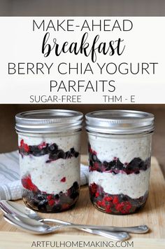 two mason jars filled with berry chia yogurt parfaits