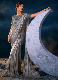 Silver Grey Sequence Embroidered Festive Saree Diwali Silver Pre-draped Saree With Mirror Work, Silver Pre-draped Saree For Eid, Embroidered And Embellished Fabric For Designer Wear During Navratri, Embellished Georgette Pre-draped Saree For Celebration, Silver Pre-draped Saree With Mirror Work For Diwali, Sequin Chinon Pre-draped Saree For Diwali, Festive Pre-draped Sequined Dola Silk Saree, Silver Pre-draped Saree With Mirror Work, Silver Semi-stitched Pre-draped Saree For Designer Wear