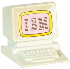 a white computer with a pink keyboard on it's back end and the word ibm written on its screen