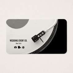 a white business card with a record player on the front and back of it, that says wedding event co new york