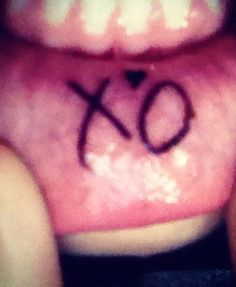 the word xo is written on someone's mouth