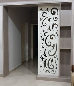 an empty room with a white and black design on the wall