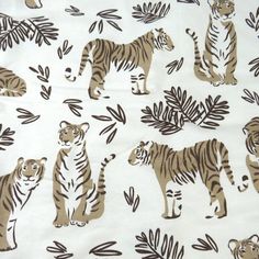 a white and brown tiger print fabric with leaves on the bottom, two tigers standing in front of them