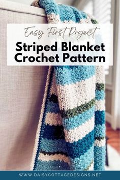 a crocheted striped blanket hanging on the back of a couch with text overlay that reads, easy first project striped blanket crochet pattern