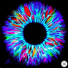 an image of a colorful eyeball in the dark