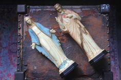 two statues of the virgin mary and jesus