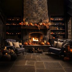 a living room filled with lots of furniture and a fire place in the middle of it