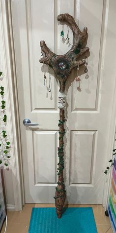 a door way with a tree branch decoration on it