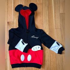 Mickey Mouse Jacket 2t New With Tags Black Mickey Mouse Hooded Hoodie, Black Mickey Mouse Hoodie, Winter Mickey Mouse Hooded Outerwear, Playful Red Long Sleeve Outerwear, Casual Long Sleeve Mickey Mouse Outerwear, Red Outerwear For Playtime In Fall, Red Outerwear For Fall Playtime, Minnie Mouse Jacket, Mickey Mouse Jacket