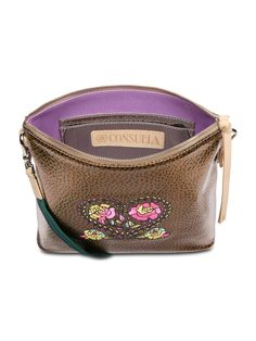 This embroidered crossbody bag is ready to take on the day with an adjustable strap and two interior pockets. Crafted with a roomy open interior, the Downtown Crossbody can carry the essentials and more. Details & Sizing Bronze textured exterior with heart motif embroidery Zipper closure Interior slide pocket and credit card slots Includes detachable and adjustable woven crossbody strap Trimmed in natural, untreated leather 11” (W) x 9 ¼” (H) x 3” (D), 14 ½”-27” adjustable crossbody strap drop M Embroidered Crossbody Shoulder Bag For Everyday Use, Embroidered Pouch For Everyday Use, Embroidered Leather Crossbody Bag, Handmade Multicolor Embroidered Crossbody Bag, Consuela Crossbody Bags, Fall Crossbody Bag With Silver-tone Hardware, Mexican Crossbody Bag, Motif Embroidery, Heart Motif