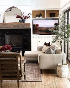 a living room filled with furniture and a fire place