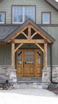 an image of a wooden door in front of a house that is for sale on pinterest