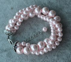 I make the pink bracelet  to use 6mm and 10mm glass pearls.  The bracelet lengh is 8 inches ,IT has a 2 inches long adjustable chain.IT is good bracelet for your  great wedding. I can make different type bracelet  to your requirements,Please feel free to contact me if you have any question. Thank you so much. . Elegant Pink Pearl Bracelet With 8mm Beads, Good Bracelet, Pink Pearl Bracelet, Pearl Bracelet Wedding, Bracelet Pearl, Rose Bracelet, Bracelet Wedding, Bridesmaid Bracelet, Pink Bracelet