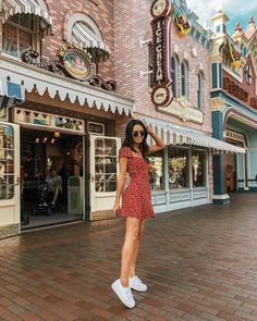 a woman standing in front of a store on instagram