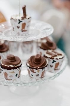 cupcakes with chocolate frosting on a glass plate