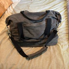 This Tote Is An Incredible Travel Bag. The Material Is A Canvas And The All The Zippers Have The Plastic On Them Expect One. Never Used Only Been In Storage. The Color Is A Nice Charcoal Color. Charcoal Color, Canvas Material, Travel Bag, Travel Bags, Black And Grey, Bag Lady, The Incredibles, Canvas, Travel