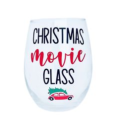 a wine glass with the words christmas movie glass printed on it and a red car