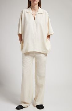 This Italian-made woven top is cut in a signature roomy The Row fit from a wool blend softened by silk and given its texture by linen. 26" length (size X-Small) Johnny collar Elbow-length sleeves 49% wool, 26% silk, 25% linen Dry clean Made in Italy Designer Clothing Modern Linen Blouse With Relaxed Fit, Relaxed Linen Blouse For Work, Modern Linen Blouse For Work, Cream Linen Tops For Daywear, Cream Linen V-neck Top, Cream Linen Loungewear Tops, Cream Linen Tops For Loungewear, Modern Linen Tops For Daywear, Elegant Neutral Linen Blouse