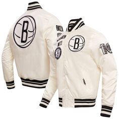 Add some incredible flair to your Brooklyn Nets game day look with this Pro Standard  Retro Classic Satin Full-Snap Jacket. This eye-catching jacket features a blend of classic and modern design elements, with heat-sealed Brooklyn Nets logo patches. The satin fabric provides a luxurious sheen, while the rib-knit collar, cuffs, and hem offer a comfortable and stylish fit. White Outerwear For Game Day In Winter, White Winter Outerwear For Game Day, White Baseball Collar Outerwear For Sports Events, White Varsity Jacket With Button Closure, Game Day Outerwear With Ribbed Cuffs For Sports Season, Long Sleeve Outerwear With Ribbed Cuffs For Game Day, White Baseball Collar Outerwear For Sports Season, White Varsity Jacket With Ribbed Cuffs For Game Day, Collegiate White Track Jacket For Sports Events