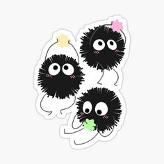 three black and white stickers with eyes, one has a bow on its head