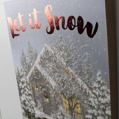 As you gaze upon the "Let It Snow" Wooden Sign with Rope Hanger, you can't help but feel the warmth of romance in the chilly air. The serene winter wonderland depicted in this art piece is truly a sight to behold. A rustic red truck, adorned with snow, sits majestically in the snow-covered scene, with a freshly cut pine tree resting in its bed. As you follow the scene, your eyes are drawn to a peaceful cottage in the distance, dressed in twinkling lights and a festive wreath adorning its door. T Dona Gelsinger, Festive Wreath, Accent Wall Decor, Baby Organization, Pergola Shade, Red Truck, Outdoor Ceiling Fans, Twinkle Lights, Let It Snow