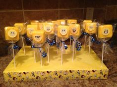 a bunch of yellow lollipops sitting on top of a counter