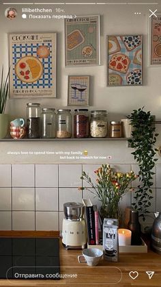 the kitchen counter is covered with jars and flowers, candles, and other things on display