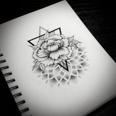 a drawing of a flower and triangle on paper